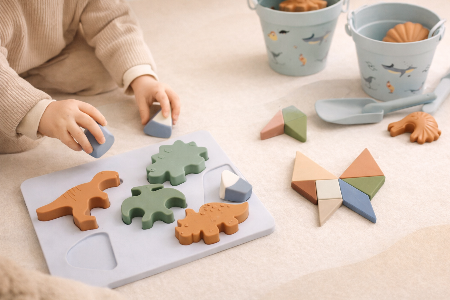 Parents and child playing with silicone beach toys